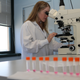 Forensic palynologist Shannon Ferguson looks at pollen grains under the microscope.
